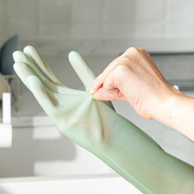 Long green latex cleaning gloves